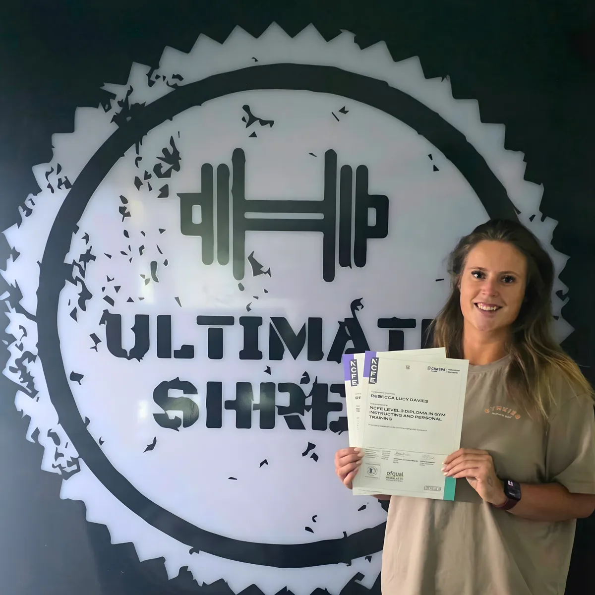 PT Launch Lab graduate holding their NCFE Level 3 personal trainer certificate